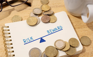 paper displaying Risk vs Reward When Investing