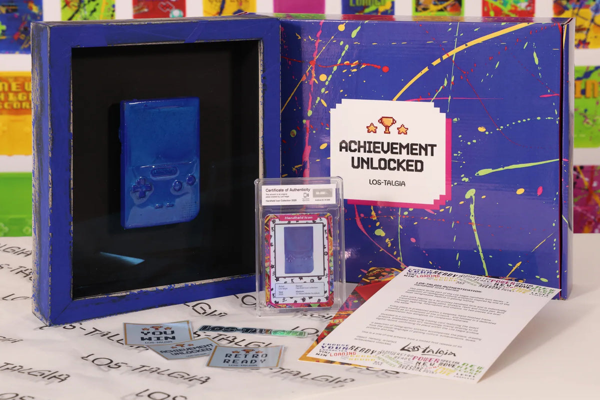 HI-005 photographed from the front: the framed piece with its certificate card, presentation box, stickers and authentication sheet.